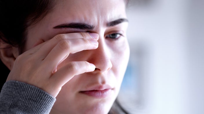 Woman with sore eyes