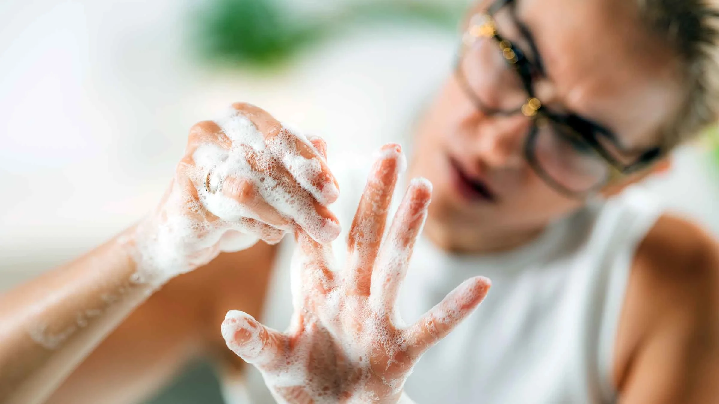 Woman obsessively washing her hands.