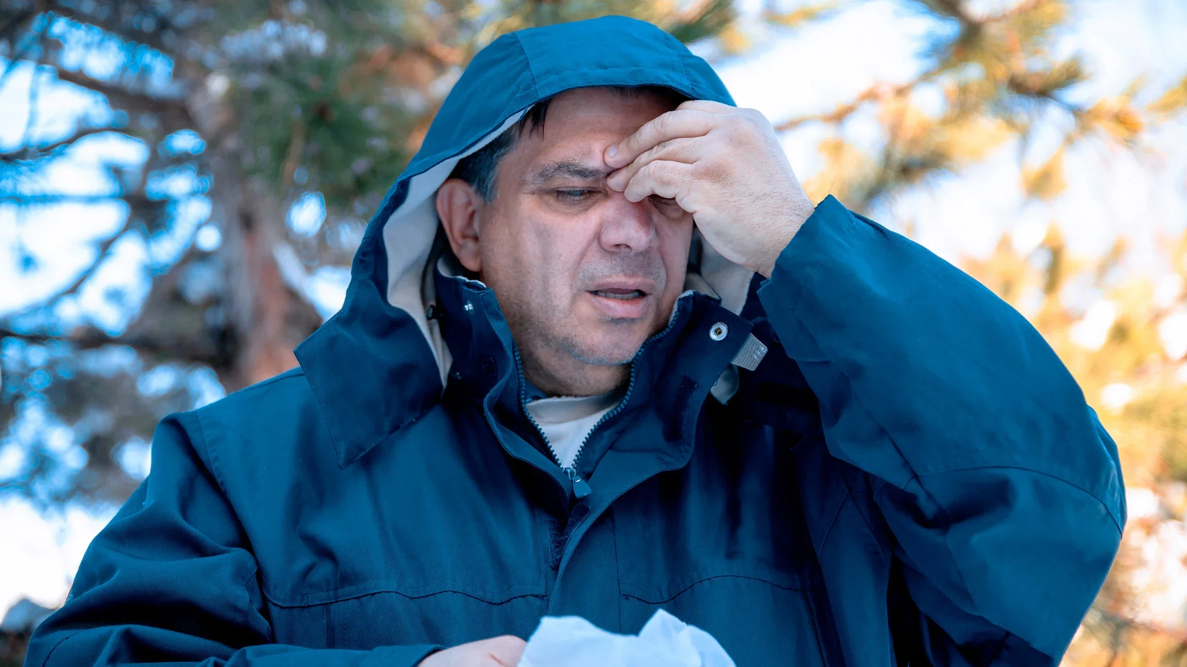 A person with a sinus headache outside.	
Biserka Stojanovic/iStock via Getty Images Plus 