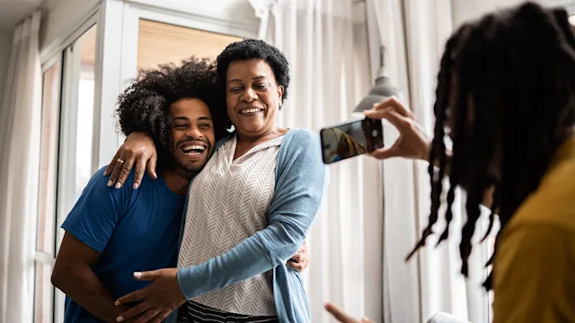 Mental Health: man taking photo of family 1350657046