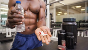 Movement exercise: shirtless taking pill at gym 844092542