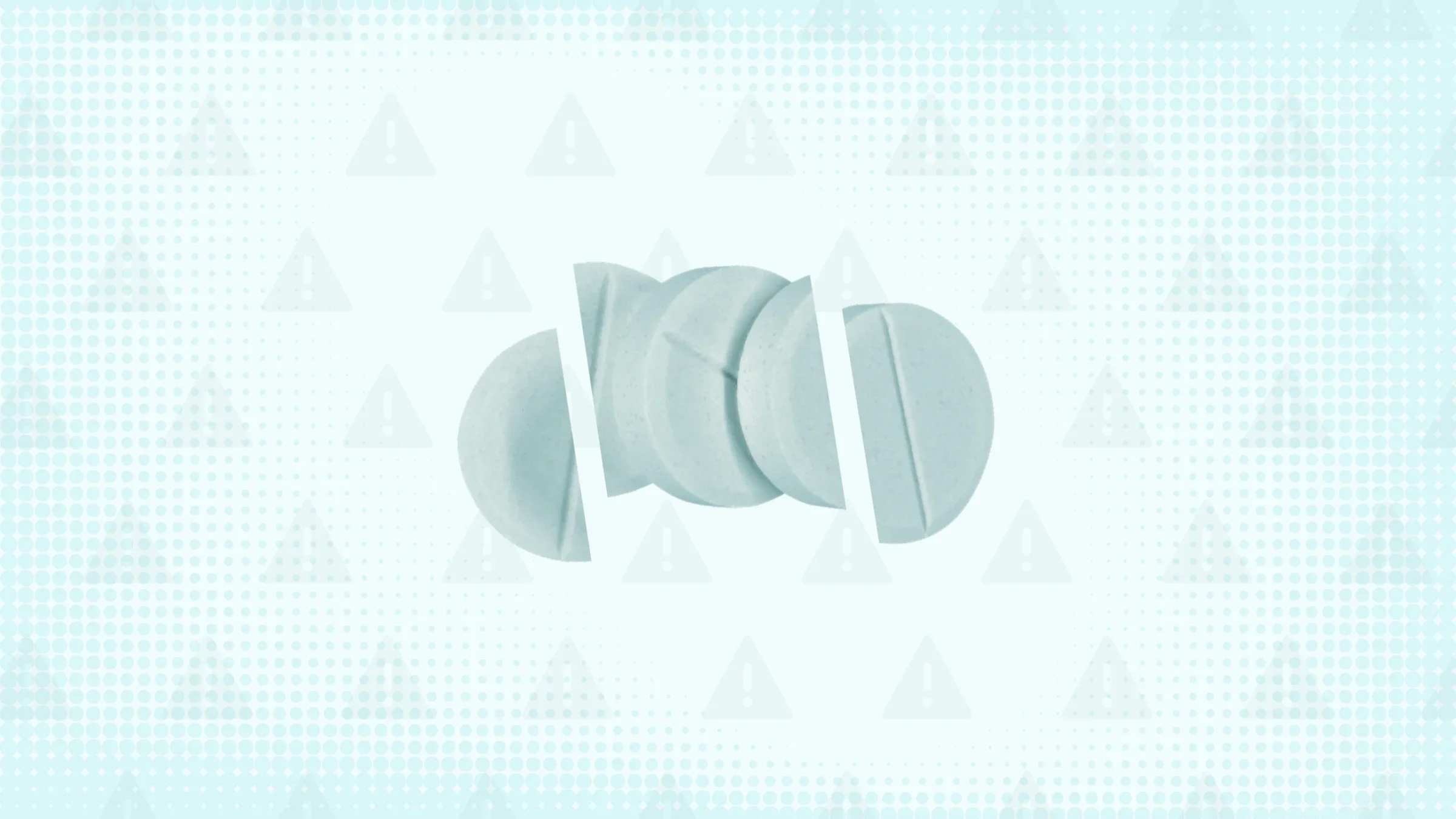 Blue-teal background with texture and warning sign pattern. In the center are three round blue-ish pills cut into thirds. 
GoodRx Health