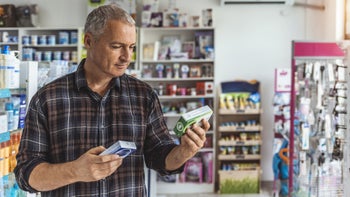 Proton pump inhibitor: man in pharmacy 1270665690