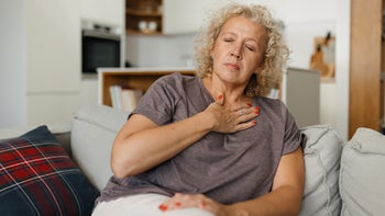 Heartburn: woman experiencing heartburn 1818362187