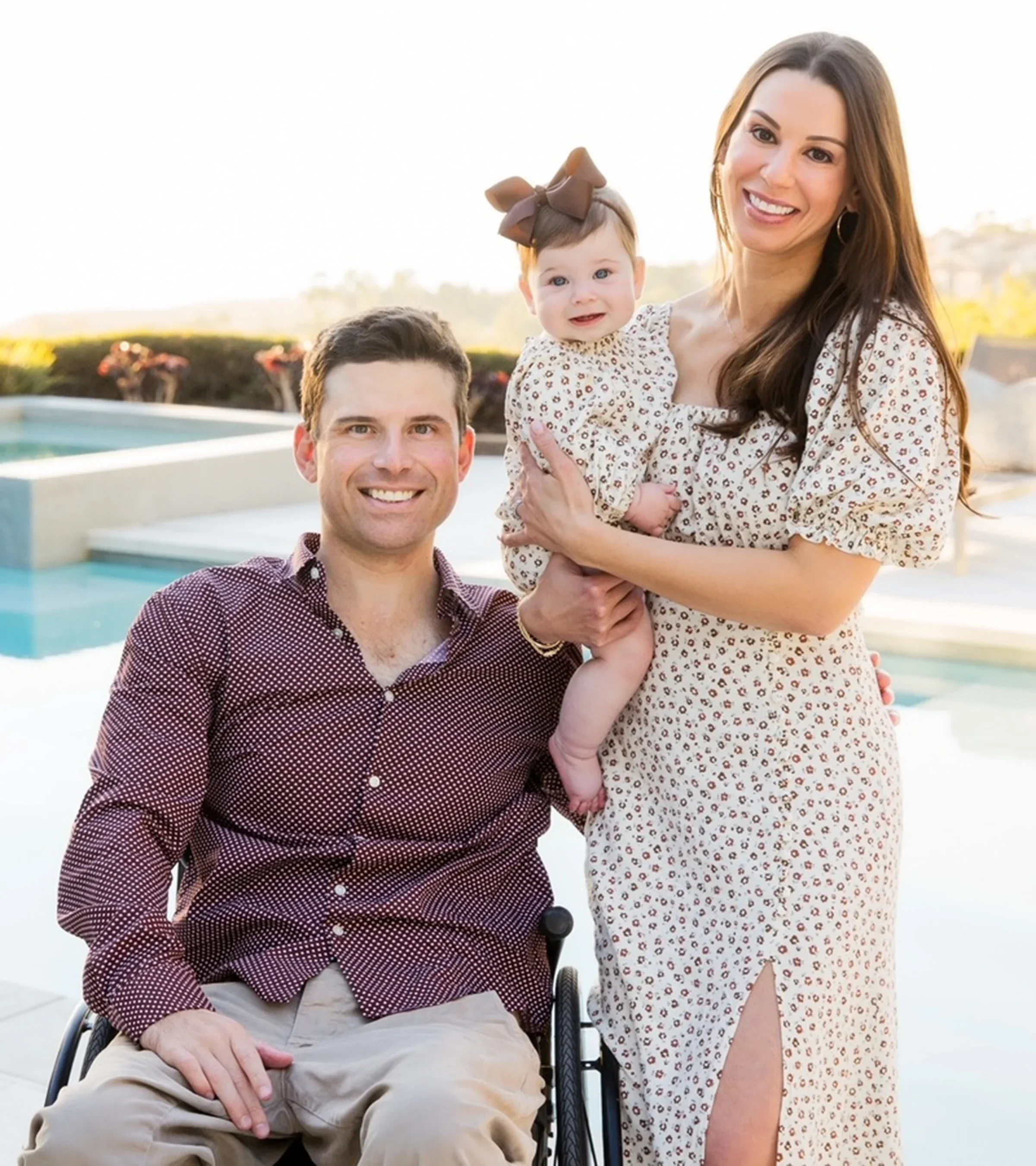 Anthony is pictured in his wheelchair, next to his daughter, Payton, and wife, Karen.