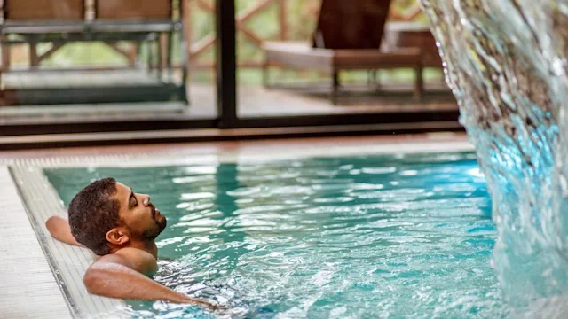 Alternative treatments: Hydrotherapy: man relaxing spa pool 1178451376