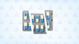 Light blue background with texture and warning sign pattern. In the center is a blister pack of blue and white pills cut into thirds.
GoodRx Health 