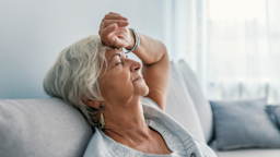 Woman resting while leaning her head back on the couch.
dragana991/iStock via Getty Images Plus
