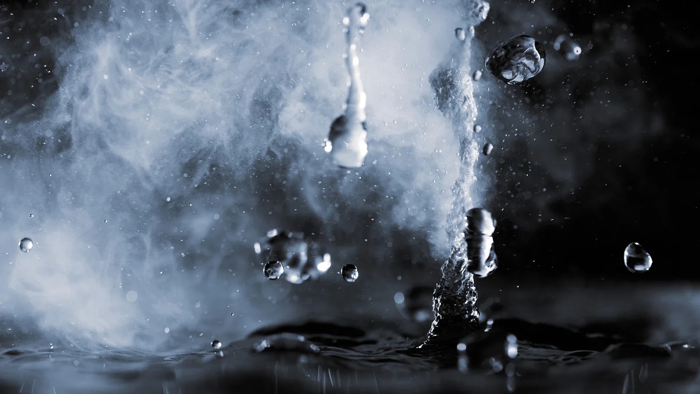 Close-up on a droplet of water and steam on a black background.
sandsun/iStock via Getty Images