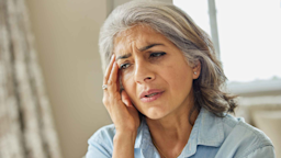 Woman at home suffering from headache
Daisy-Daisy/iStock via Getty Images Plus
