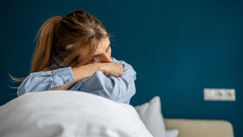 Depression: woman depressive mood in bed 1559986689