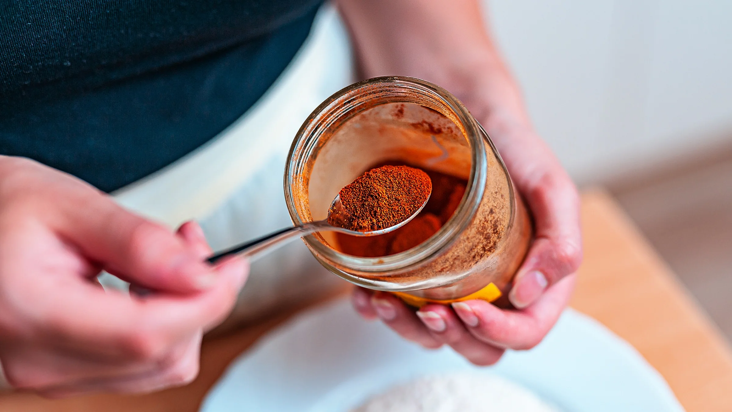 Cayenne pepper in a jar with a spoon