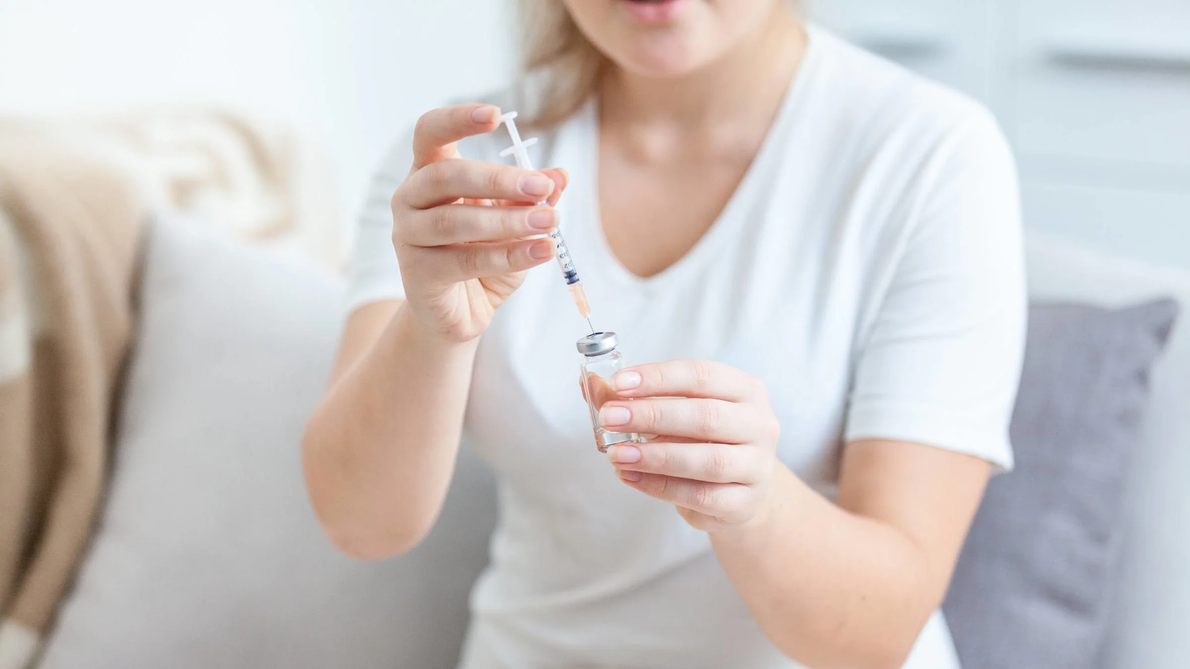 A person preparing for a self-injection.