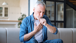 An older man experiences a dry cough and chest pain.
brizmaker/iStock via Getty Images Plus