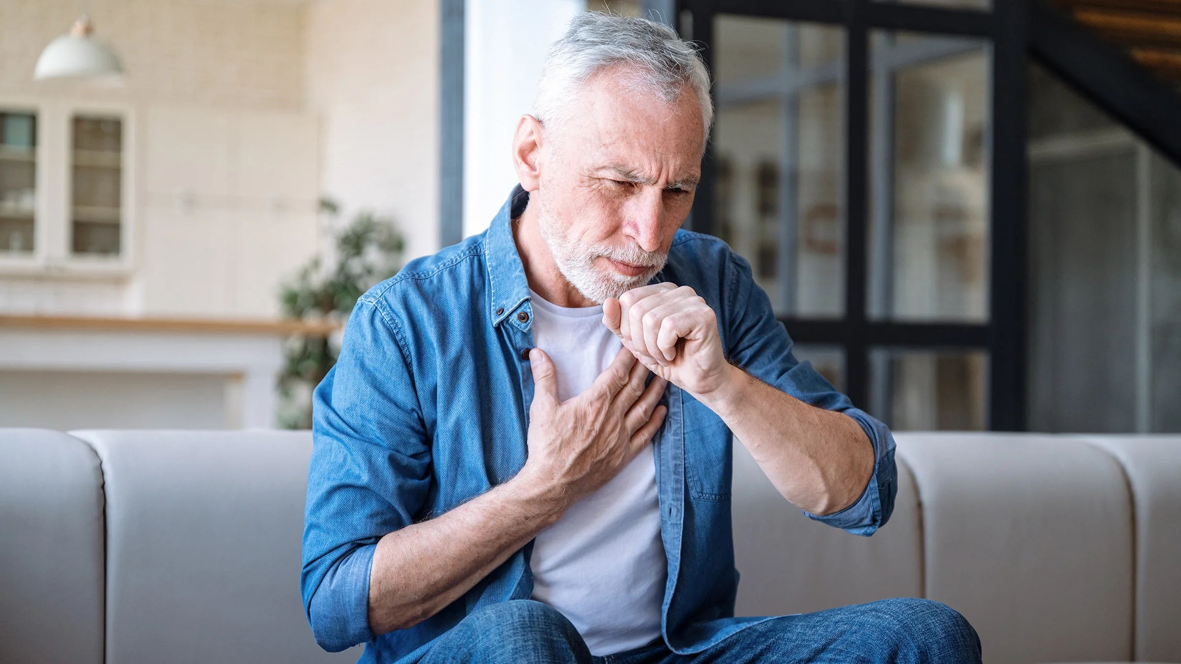 An older man experiences a dry cough and chest pain.