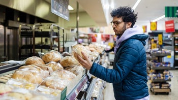 diet-nutrition: man buying bread in a supermarket 1371981289