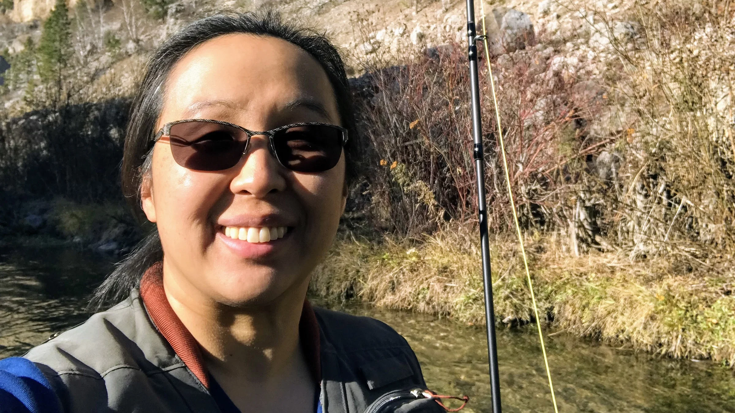 Portrait of Dr. Lisa Castaneda fishing.