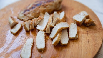 diet-nutrition: sliced grilled turkey on cutting board 2174137142