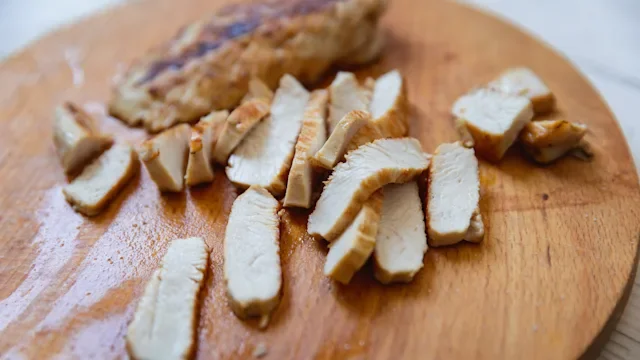 diet-nutrition: sliced grilled turkey on cutting board 2174137142
