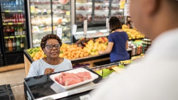 liver: woman buying meat in a supermarket 1423348752
