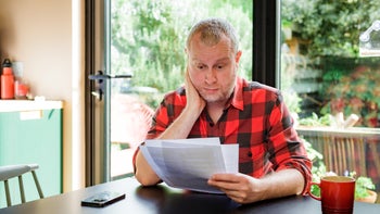 saxenda: worried man doing finances 1482366155