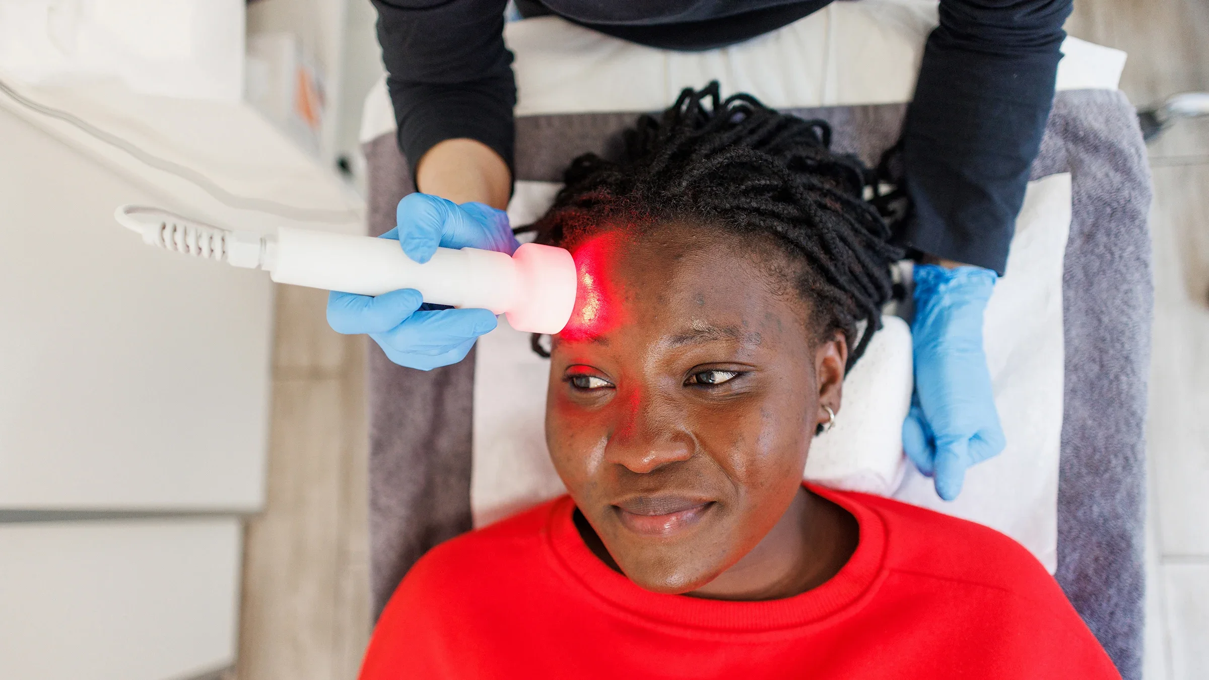Woman receiving an LED therapy facial treatment.
Constantinis/E+ via Getty Images