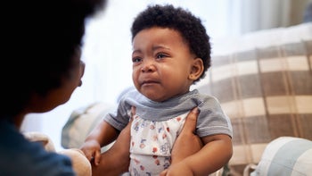 crying baby with mother-1010051874