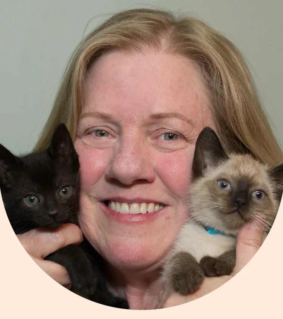 Renee Emerson is pictured in a snapshot with two kittens.