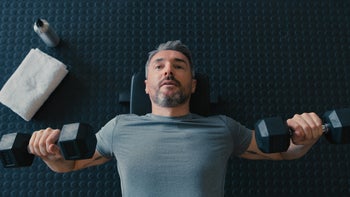 Health: Movement and exercise: man lifting weights 1347836406