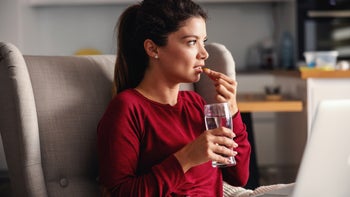 Fertility: Letrozole: taking pill on couch 1293616537