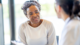 A woman speaks to a doctor during an appointment.
FatCamera/E+ via Getty Images