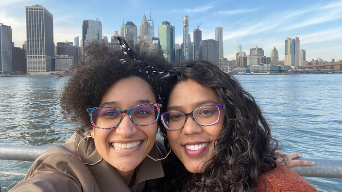 Migraine patient Sarah Shaw, left, pictured outdoors in New York City with her partner, Tara.