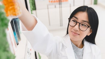 Pharmacists: Positions: pharmacist reaching for high shelf 1354046720