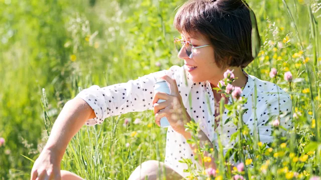 Environmental: spraying bug repellent 1346068933