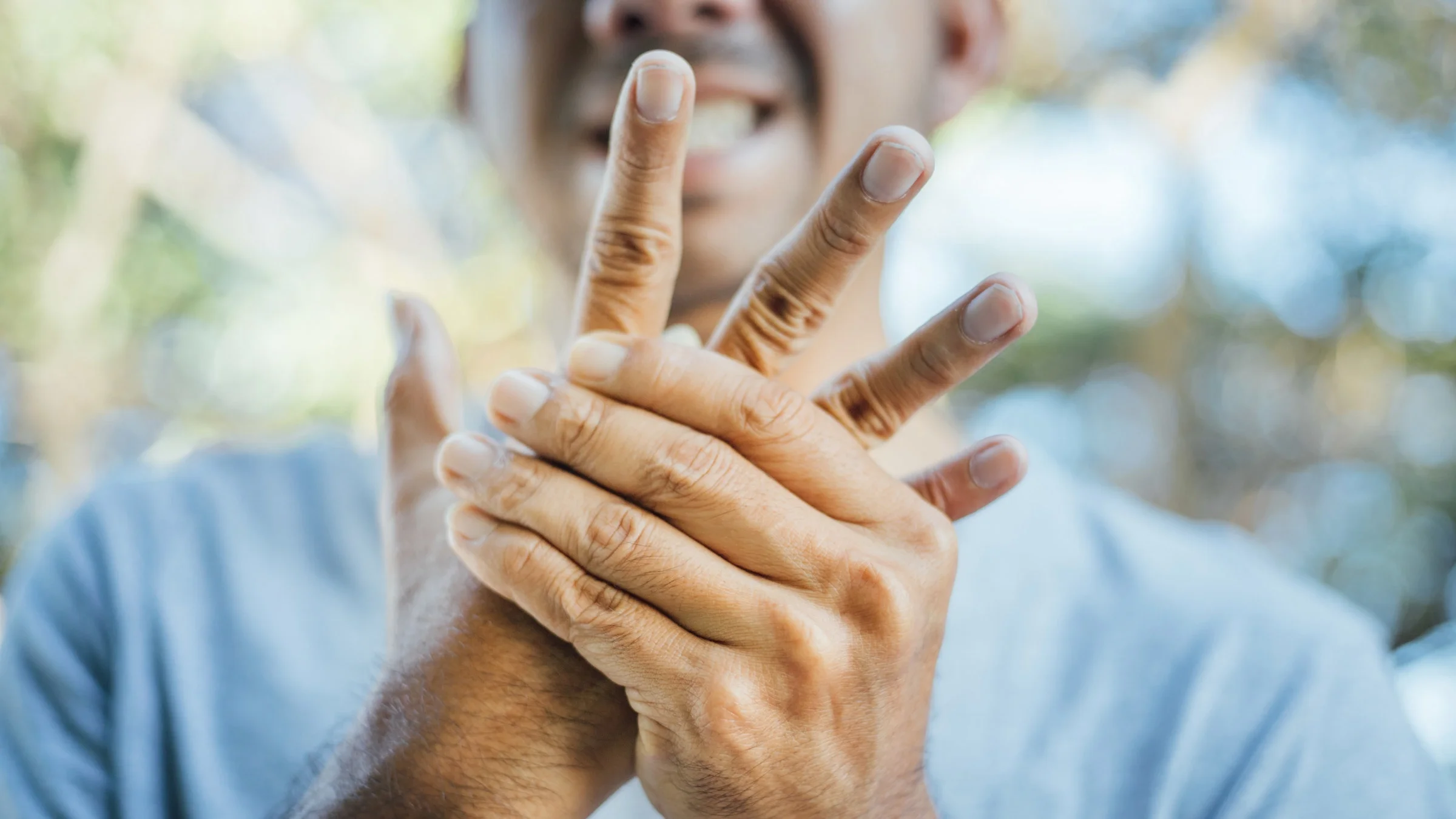 A cropped shot of someone tingling in hands.