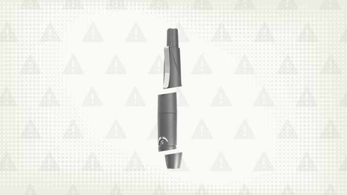 Gray background with texture and warning sign pattern. In the center is a gray injection pen cut into thirds