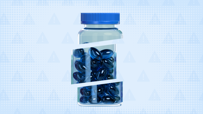 A custom graphic includes a light-blue background with a warning sign pattern and a bottle that contains blue pills cut into thirds.
