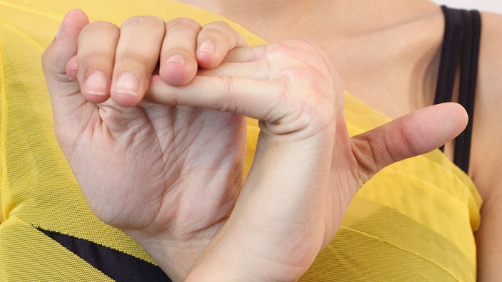 Close-up on a woman's hands that are extremely flexible.