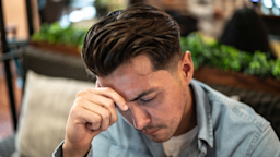A person with a headache in a coffeeshop.
FG Trade Latin/E+ via Getty Images 