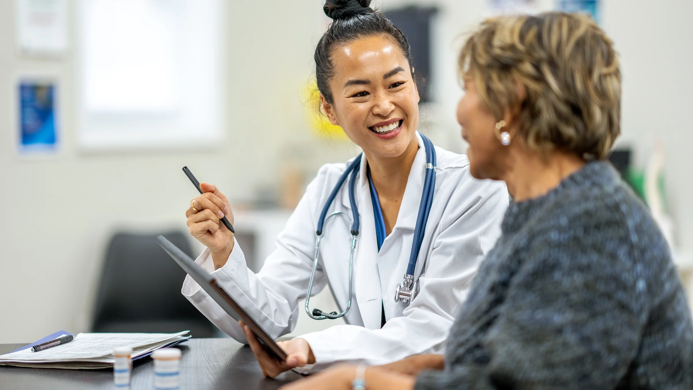 Woman speaking to a doctor.