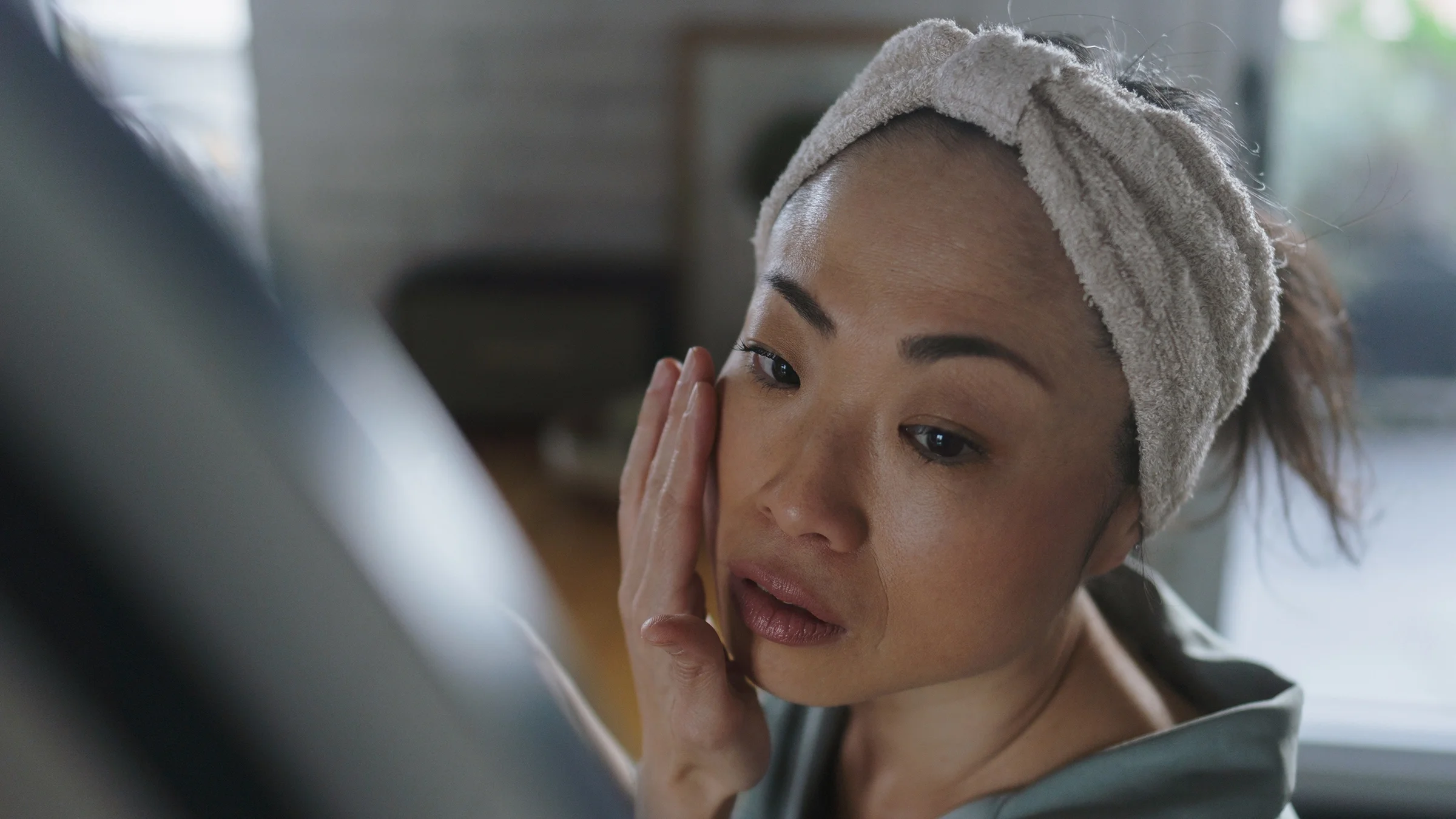 A woman does her skin care routine.