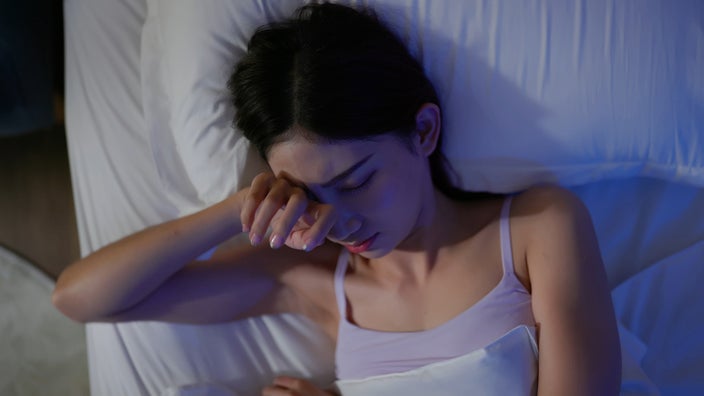 Woman suffering from insomnia.