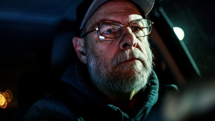 Older man driving at night