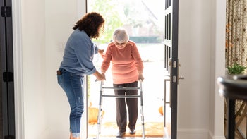 Medicare: senior woman with walker at home 1456237462