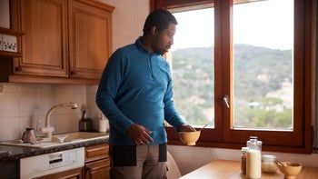 gut health: man finishing breakfast 2029904602
