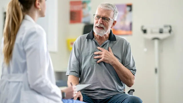 pulmonary-hypertension: senior man at medical appointment 2048636347