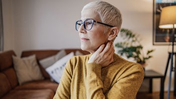 Bipolar Disorder: 1 vs 2: woman glasses look out window-1335403508