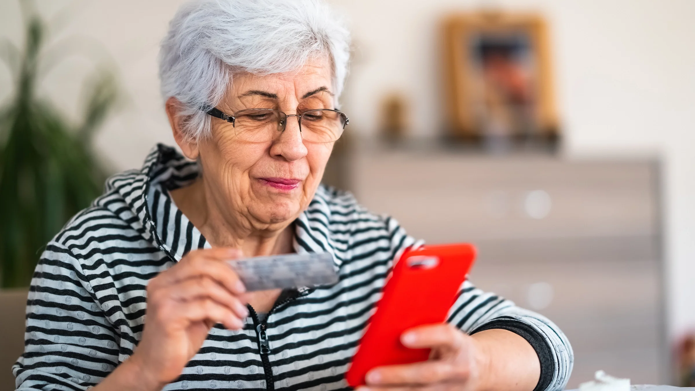  A woman discusses her medication with her provider during a telehealth call.