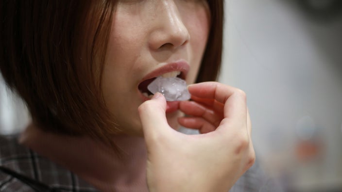 Close-up of someone eating ice.