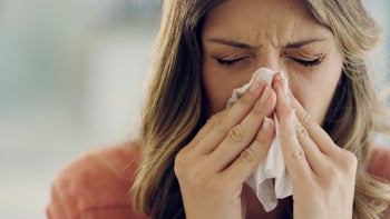 Health: Sinus infection: cropped woman blowing her nose-1176618214